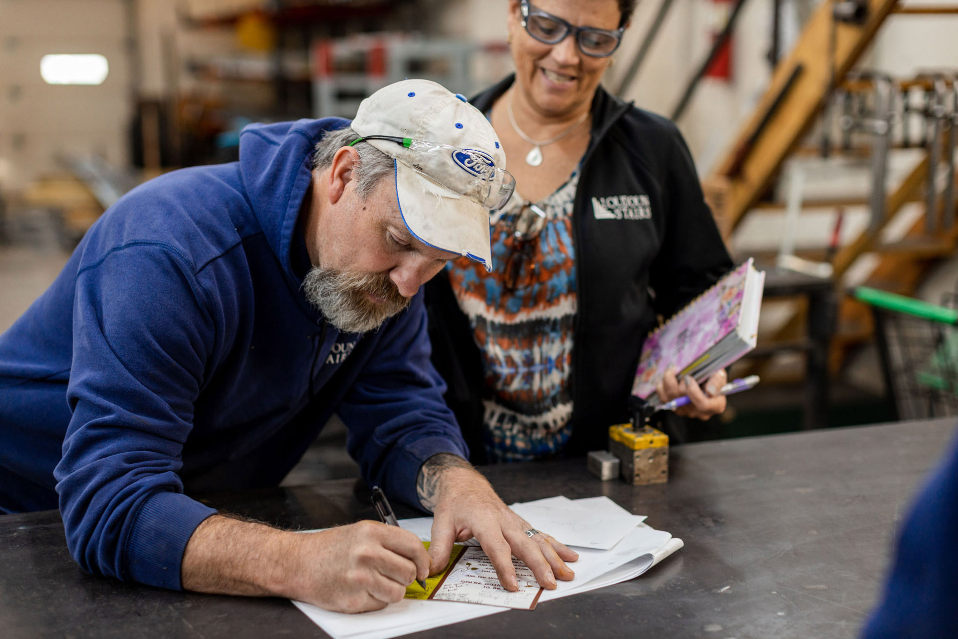 Loudoun Stairs crew working together. This displays their teamwork. 