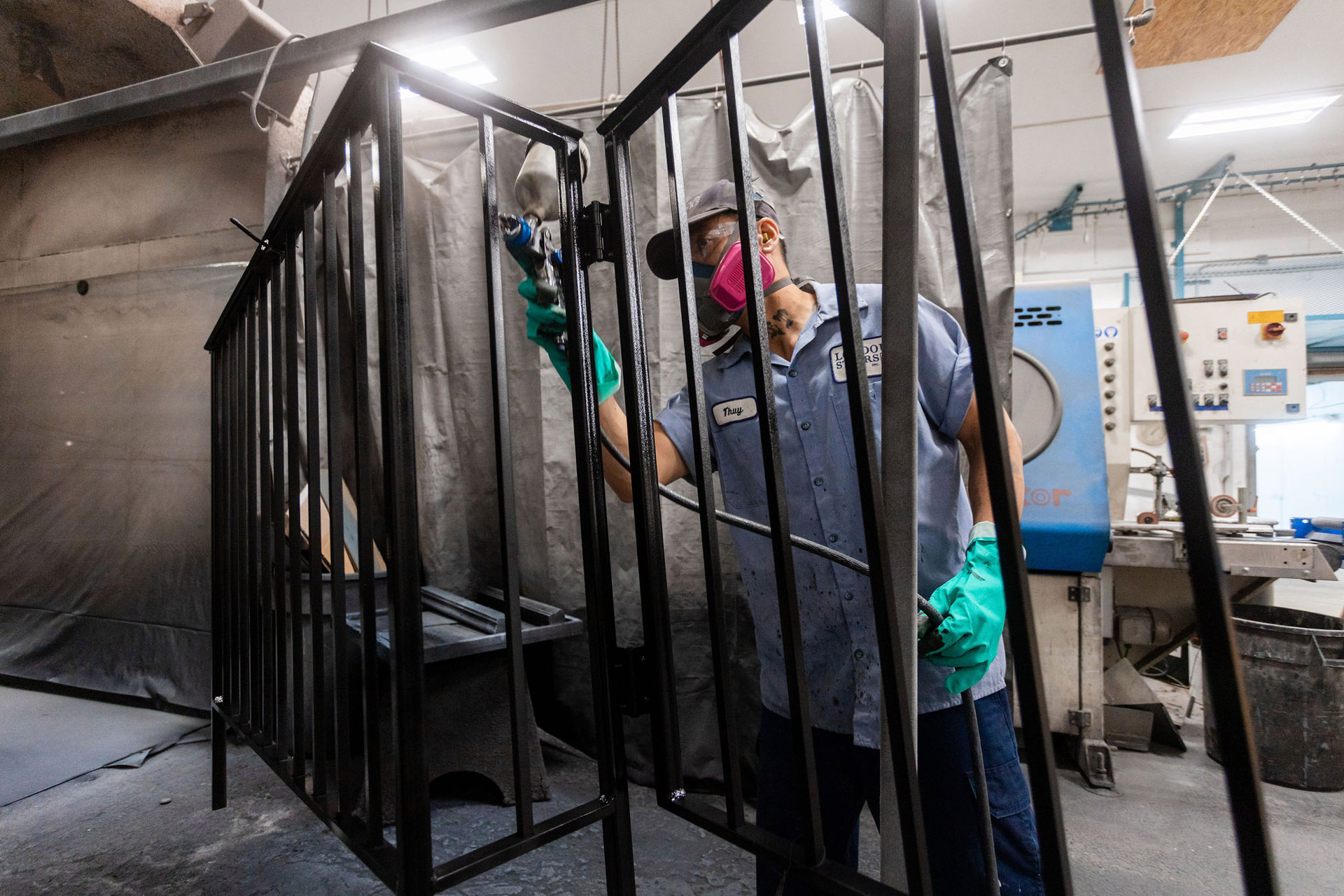 This is a Loudoun Stairs factory worker painting the metal stairs. This shows that they take care in hand painting stairs.
