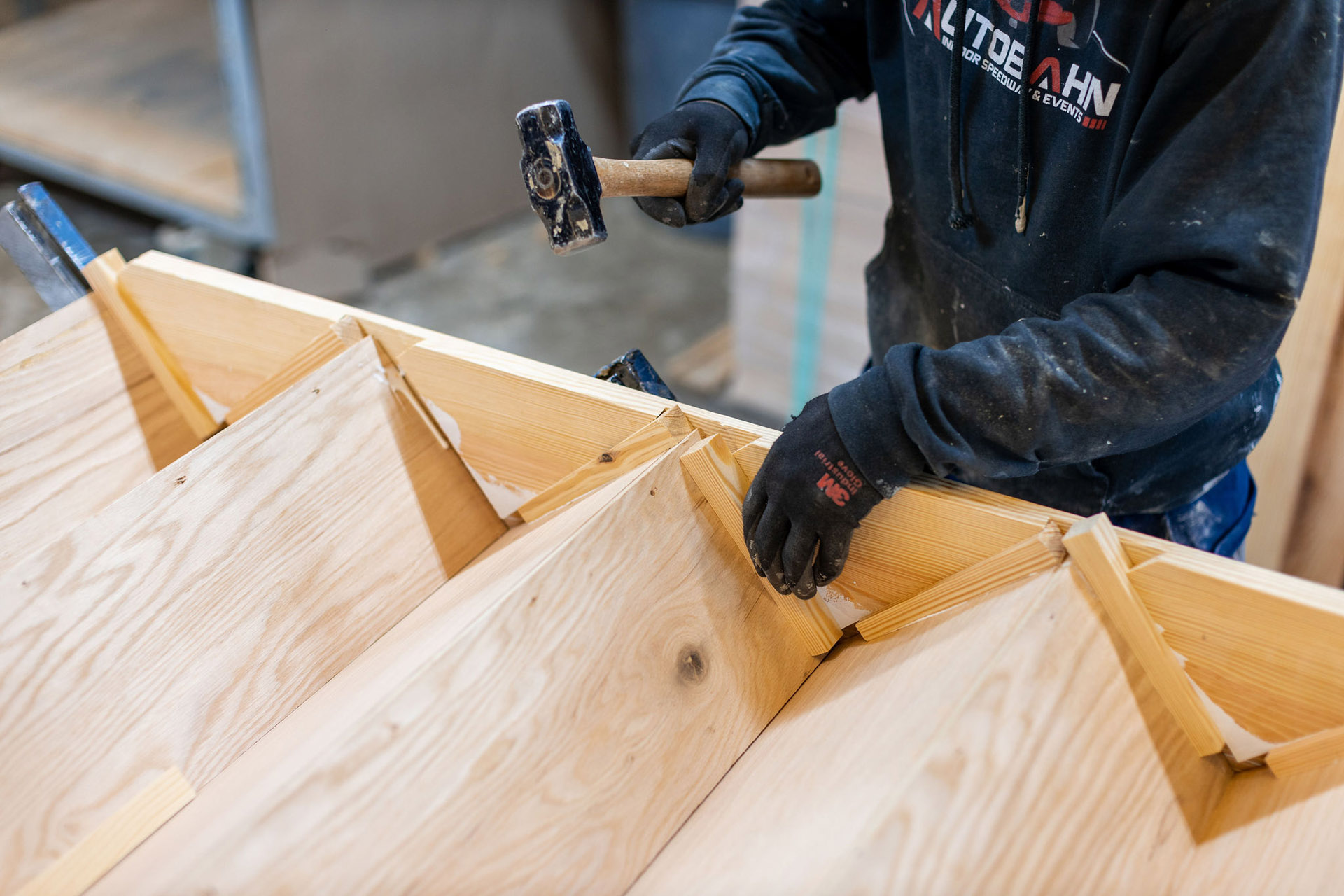 Loudoun Stairs' factory worker showing that their stairs are handmade. 