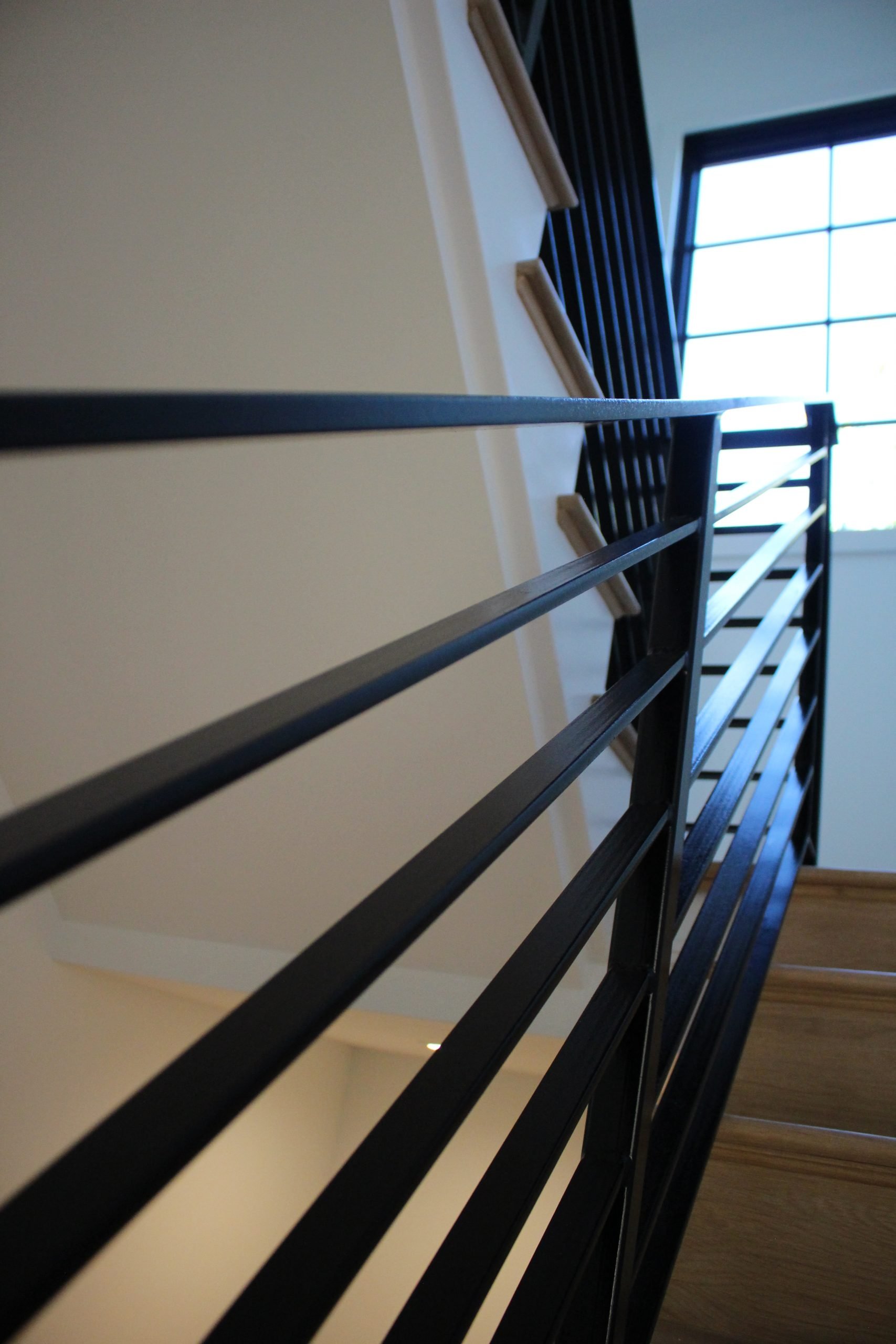 This showcases a completed loudoun stairs project within a home in northern virginia. This showcases the metal fabrication that loudoun stairs did in their shop. 